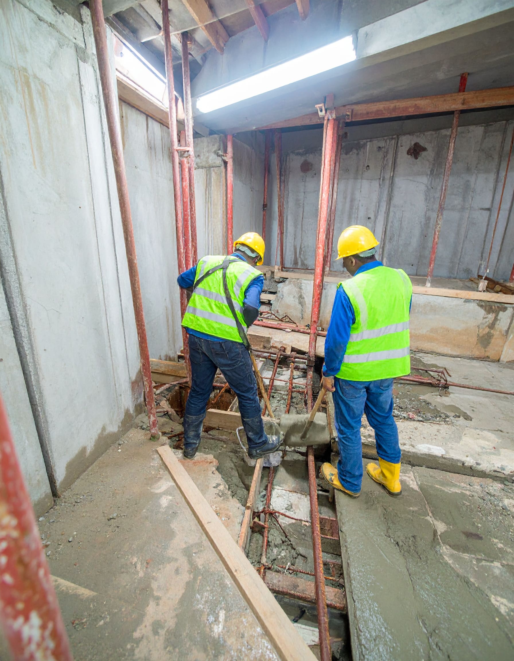 Firefly_A realistic image of African technicians performing lift shaft waterproofing at a com 324721