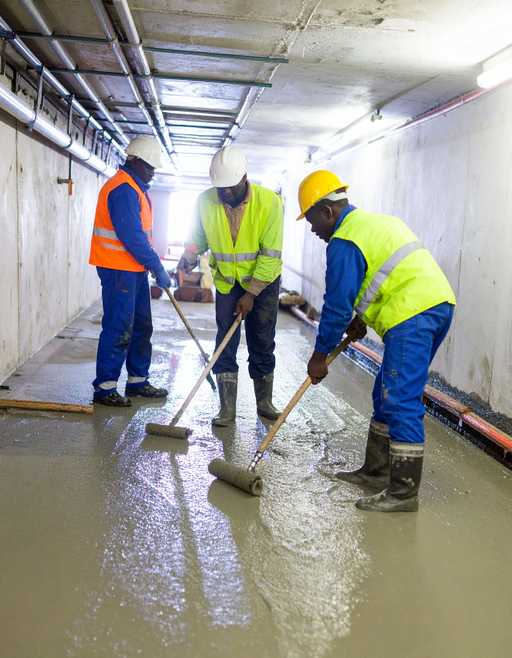 Firefly_A realistic image of African technicians waterproofing the interior of a basement or 442633