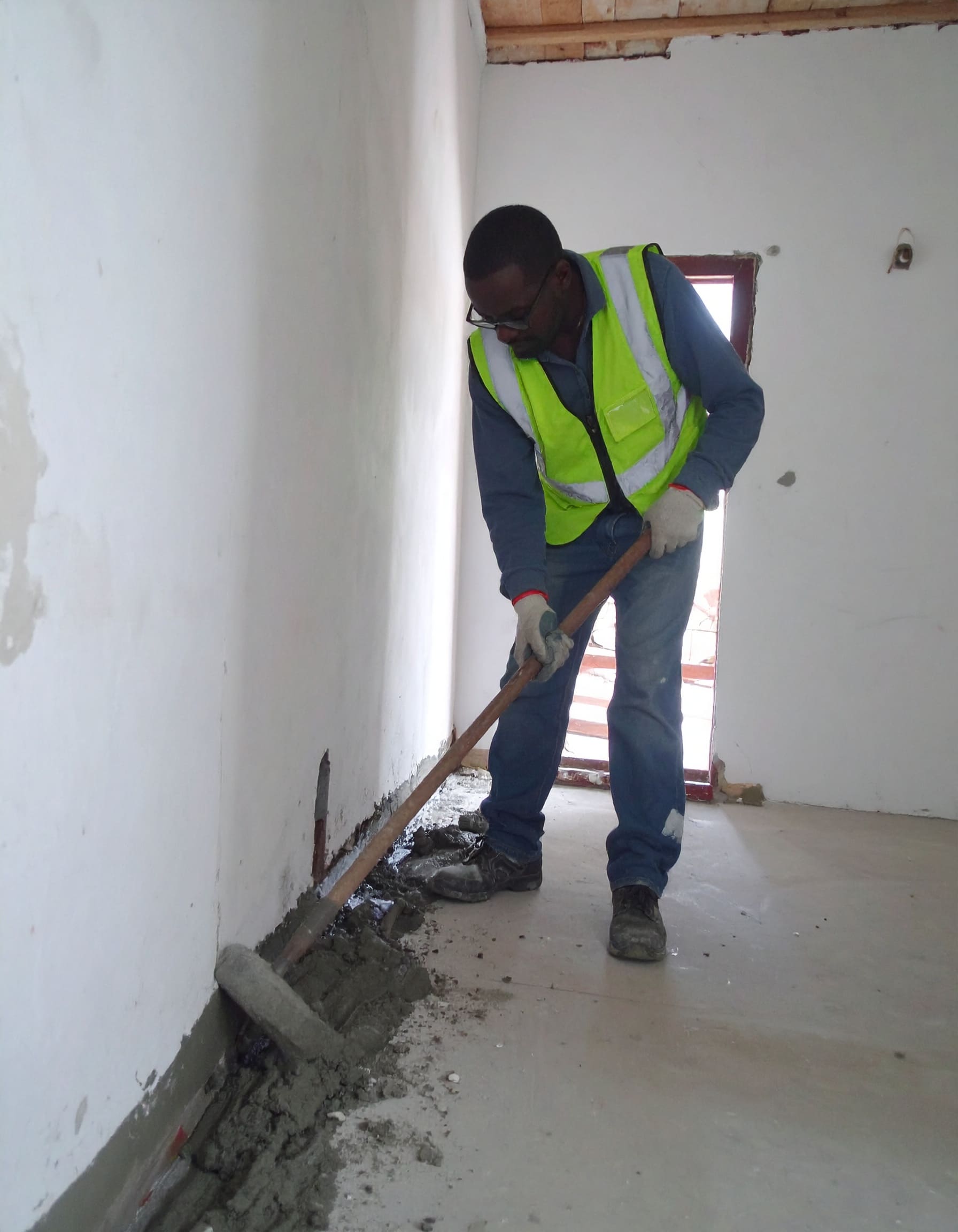 Firefly_A realistic image of an African technician treating a rising damp problem on the lowe 903162